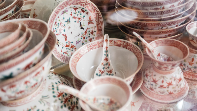 collection of fine china with red motif
