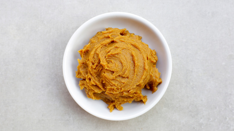 Miso paste in a small white bowl