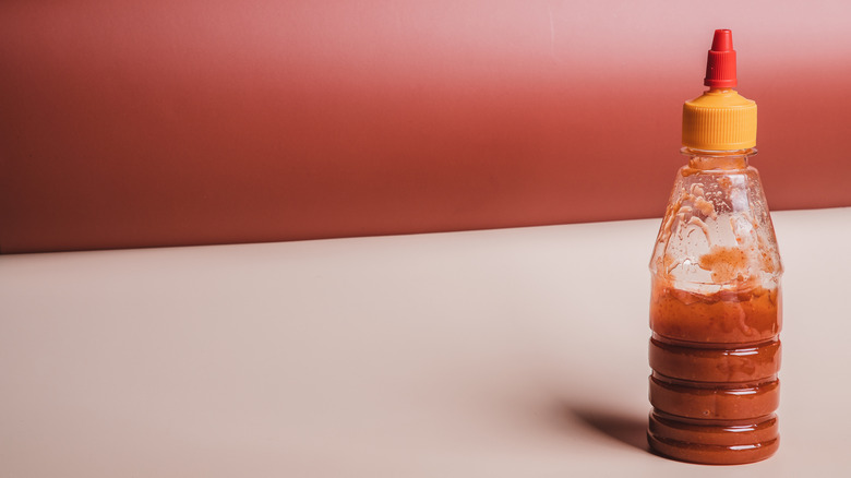 Unlabeled bottle of hot sauce