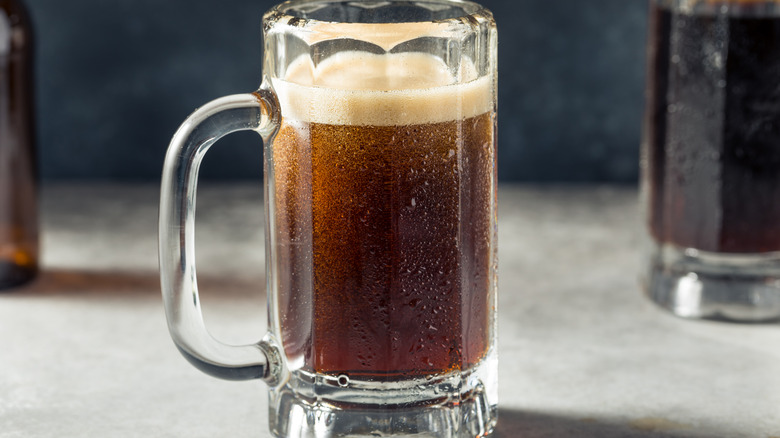 Root beer in clear mug