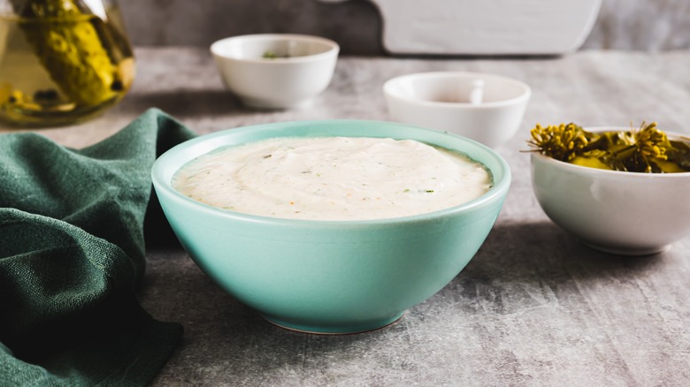 Small aqua bowl of creamy homemade ranch dressing