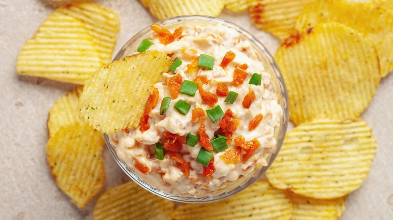 Overhead view of French onion dip with potato chips
