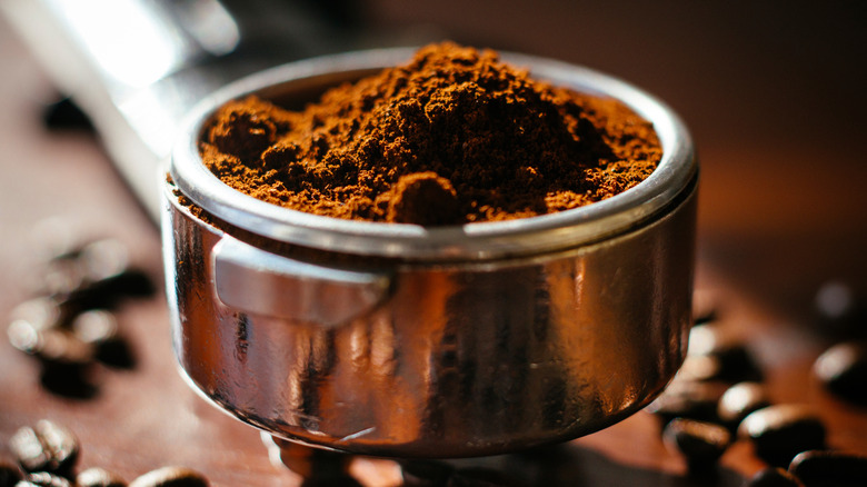 finely ground coffee in portafilter espresso basket
