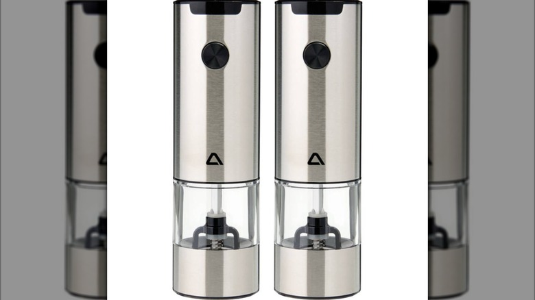 A closeup of a set of silver salt and pepper mills