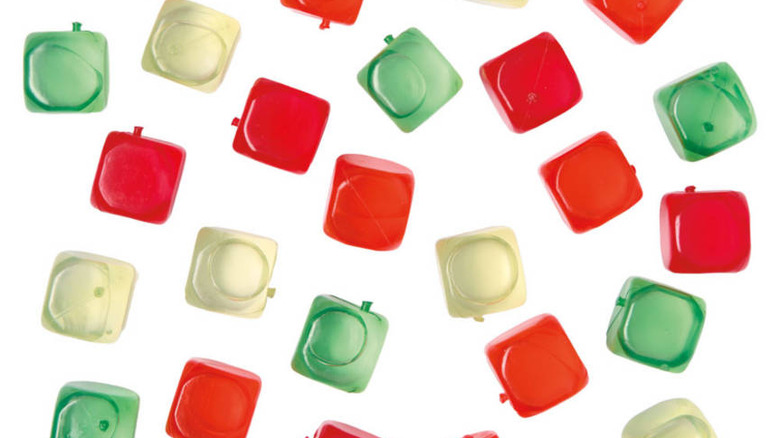 An assortment of reusable ice cubes in white, red, and green