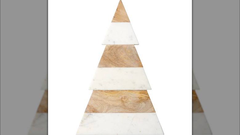 A marble and wood board shaped like a Christmas tree