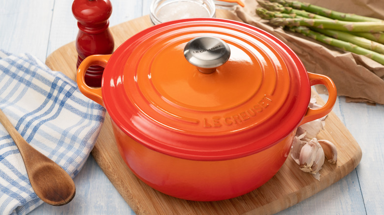 An orange Le Creuset Dutch oven