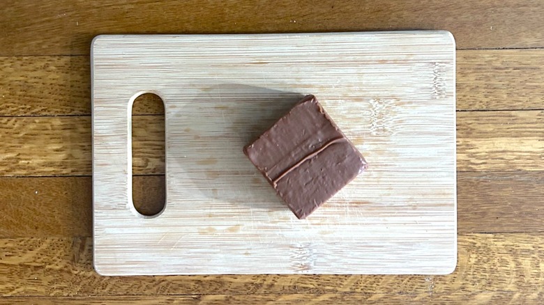 Buc-ee's Chocolate Fudge on a wooden cutting board