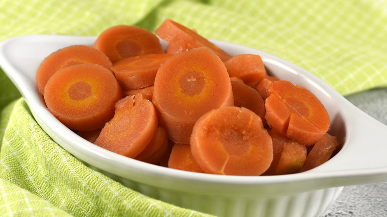 Slices of canned carrots in a white dish