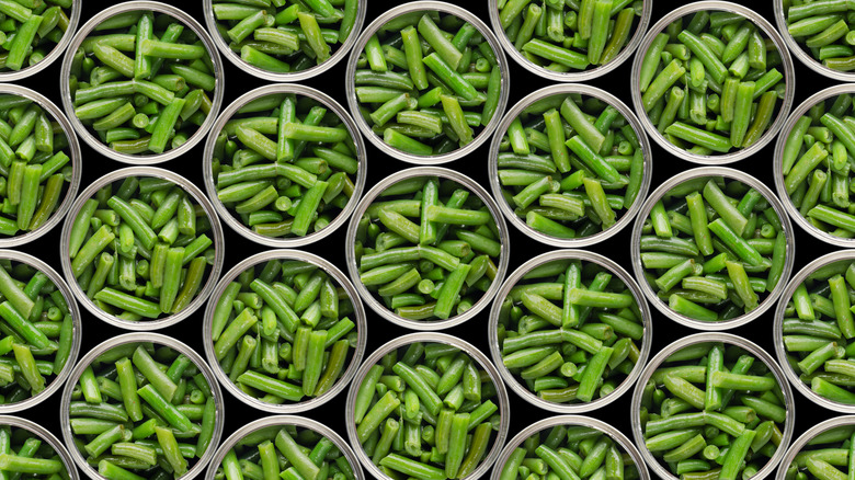 Overhead view of opened cans of green beans