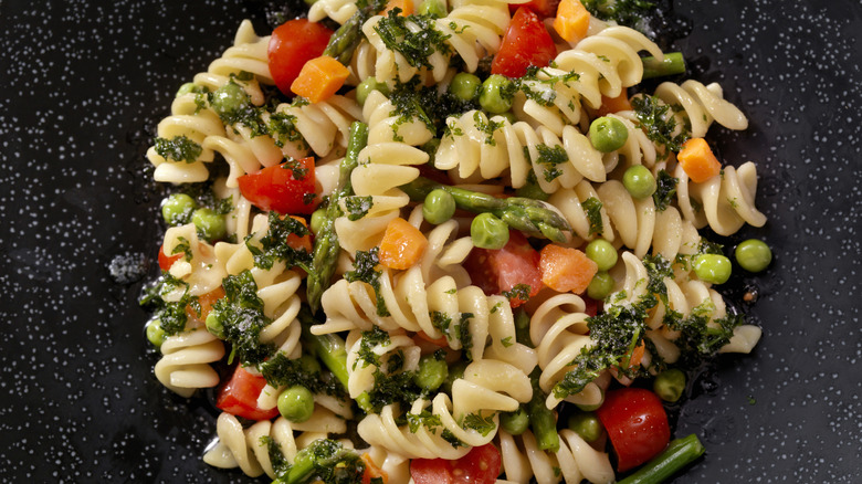 Large bowl of veggie pasta salad with peas