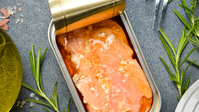 Tin of salmon with the lid peeled back