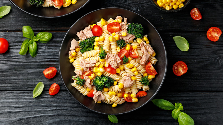 Bowl of veggie pasta salad with chunks of canned tuna