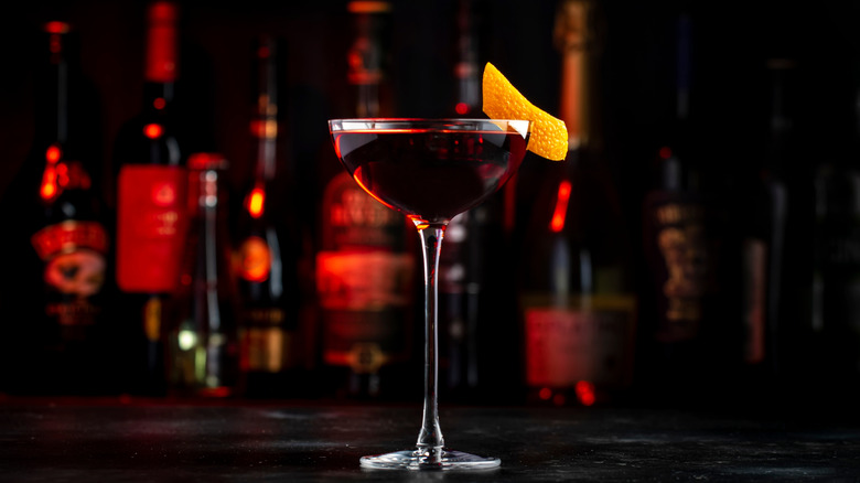 Adonis cocktail in a coupe glass garnished with orange peel