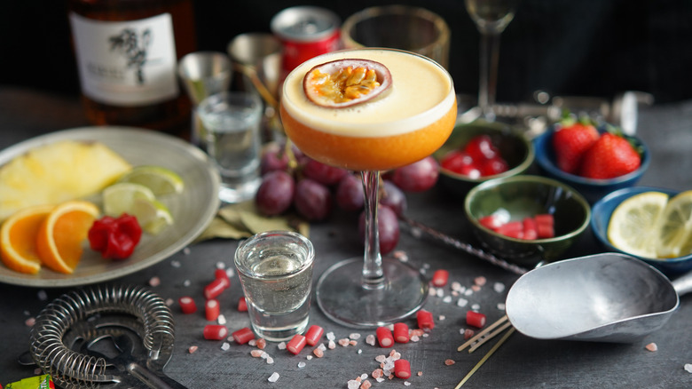 Porn Star Martini cocktail in a coupe glass next to a shot of Prosecco