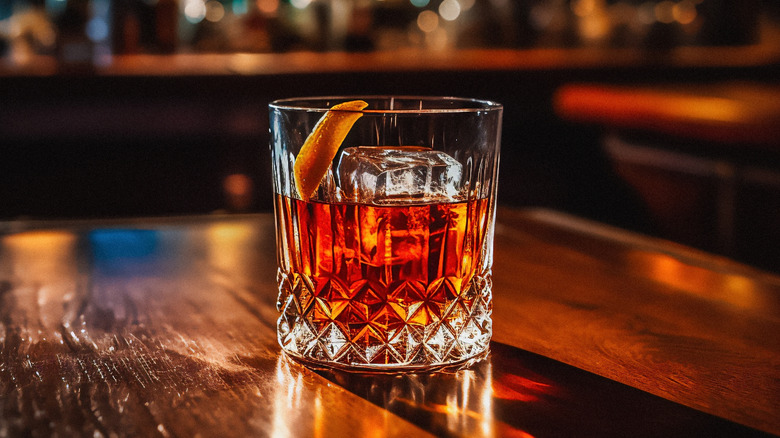 Old Fashioned cocktail on a wooden bar top
