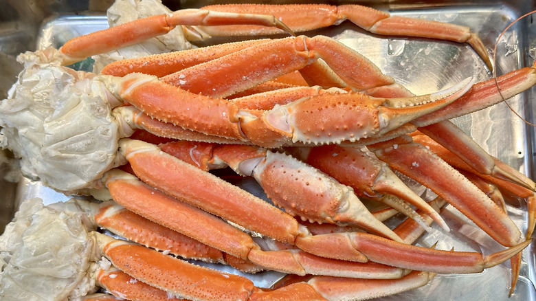 Pile of crab legs on steel platter