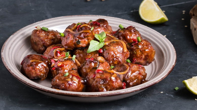 Party meatballs with sauce on a plate