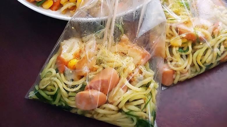 Two bags of Hong Kong-style bagged noodles with corn and sausage