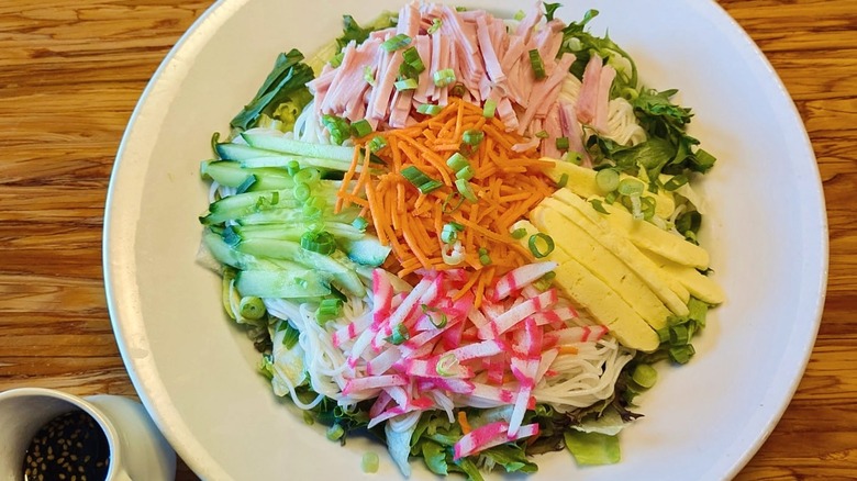 A plate of somen salad loaded with chopped raw vegetables