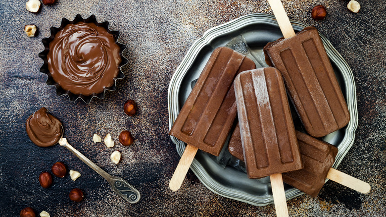 Homemade chocolate popsicles with hazelnut spread