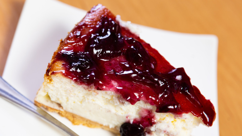 Slice of cheesecake with cranberry sauce
