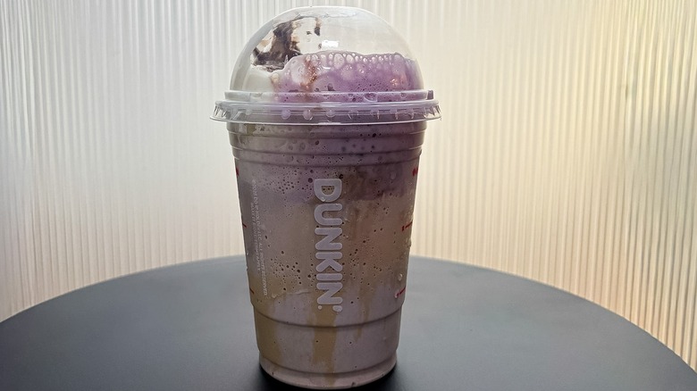 Small Dunkin' Creepy Crawler Coffee Chiller on a black table