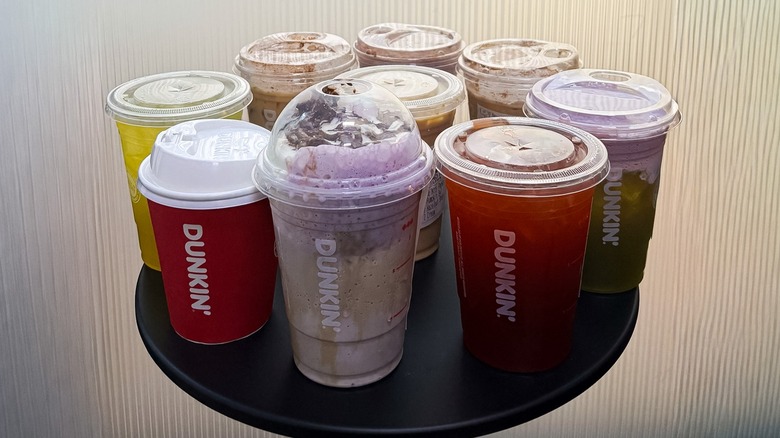 several Dunkin' fall drinks on a small black table