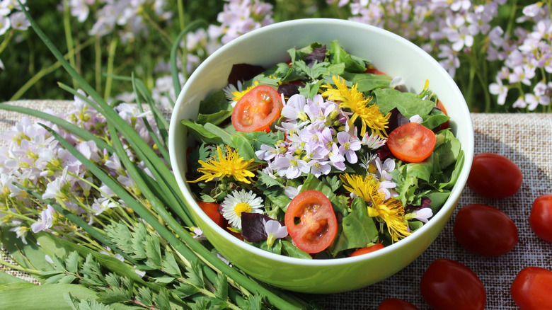 flowers on salad of eggs and mixed greens