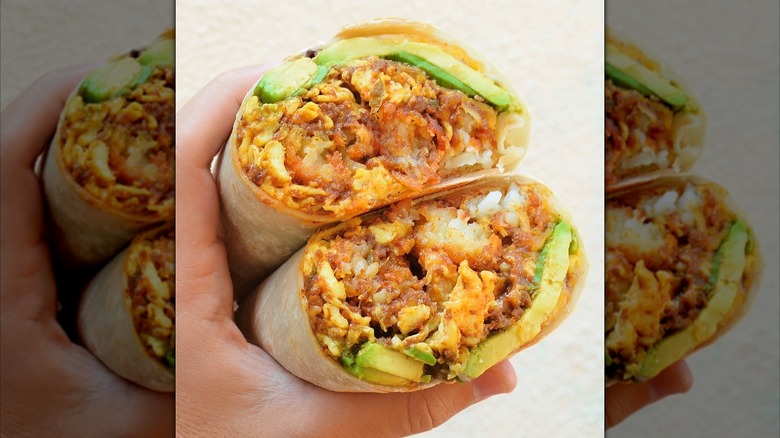 The "Signature" breakfast burrito from Söbuneh on a white background.