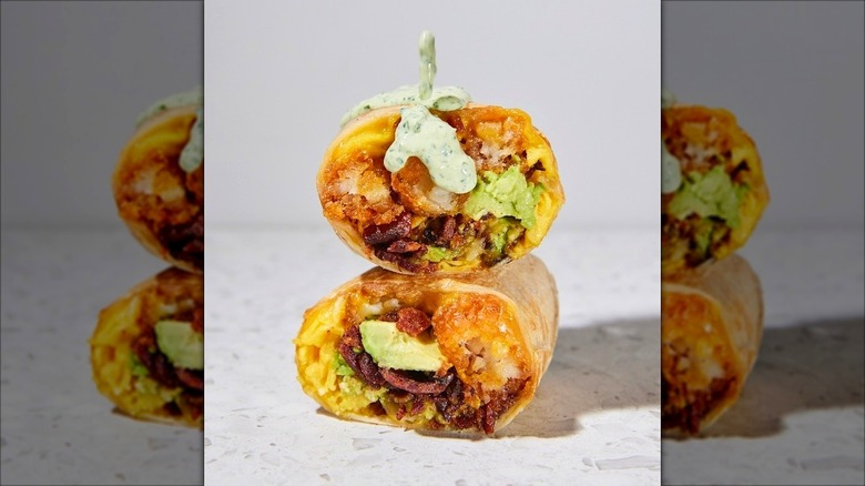 A bacon breakfast burrito from Wake and Late cut in half