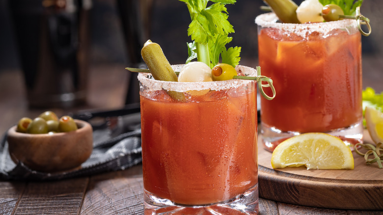 Bloody Mary in a glass with olives and celery