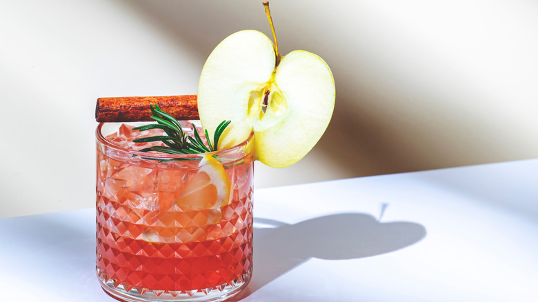 Apple cocktail with cinnamon stick