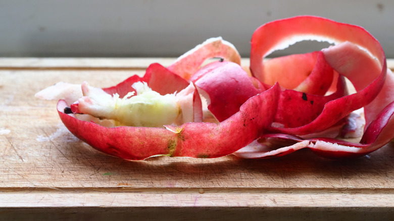 Apple peels on a wooden surface