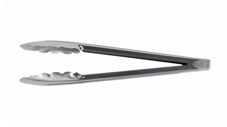 stainless steel tongs white background