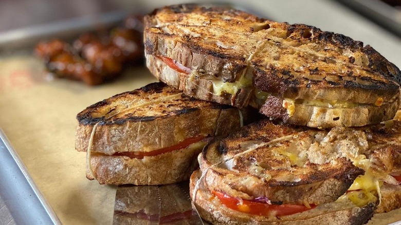 Three Braaibroodjie sandwiches on a tray