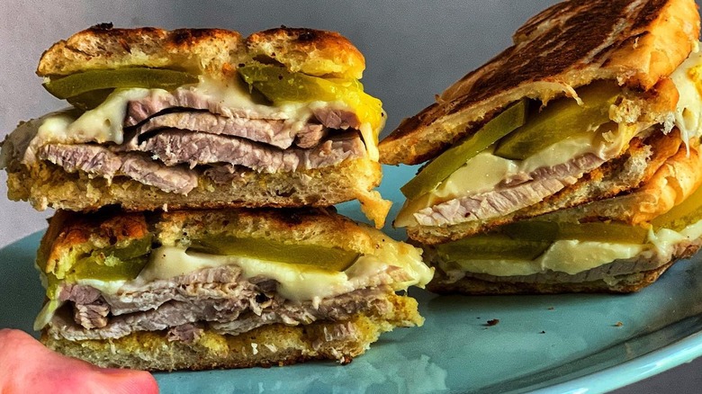A medianoche sandwich on a plate