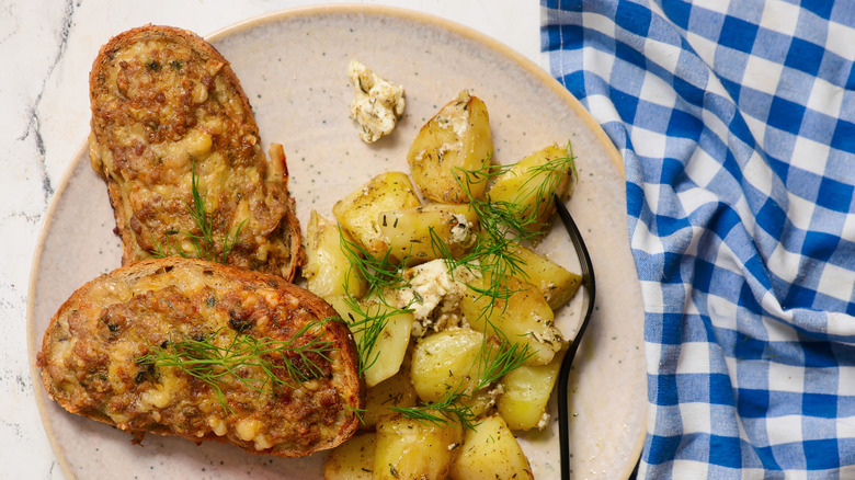 A princess sandwich on a plate with potatoes