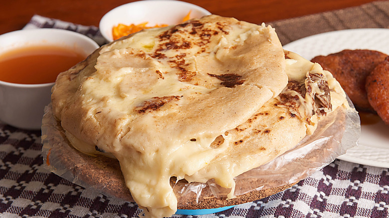Pupusas with cheese on a table