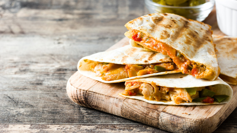 Quesadillas on a wooden cutting board