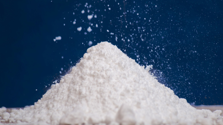 pile of powdered sugar on blue background
