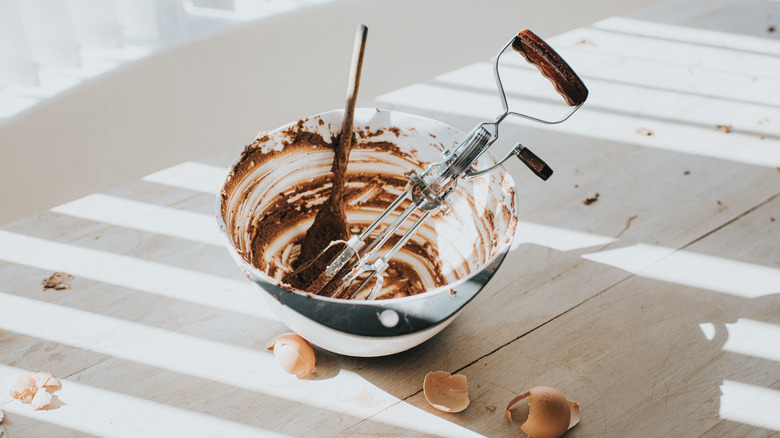 dirty bowl with chocolate batter or frosting