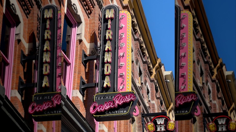 A pink and black exterior street sign for Miranda Lambert's Casa Rosa