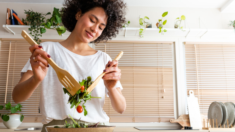 young person cooking food in the kitchen