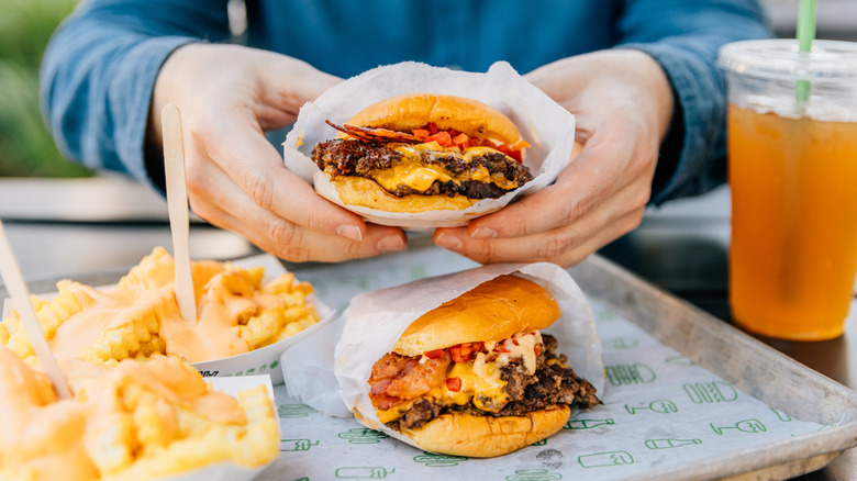 burgers and fries on table