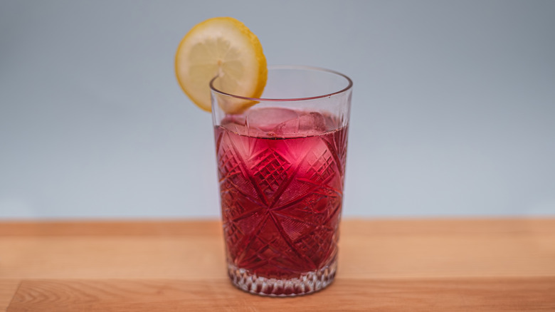 iced beverage with orange slice