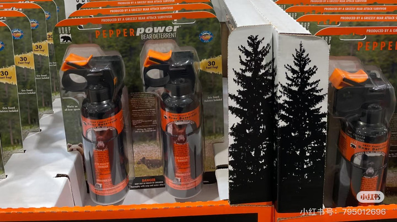 Packages of bear spray on a shelf in Costco
