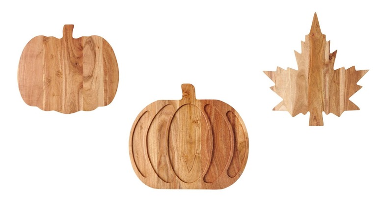 three fall-shaped wooden chopping blocks