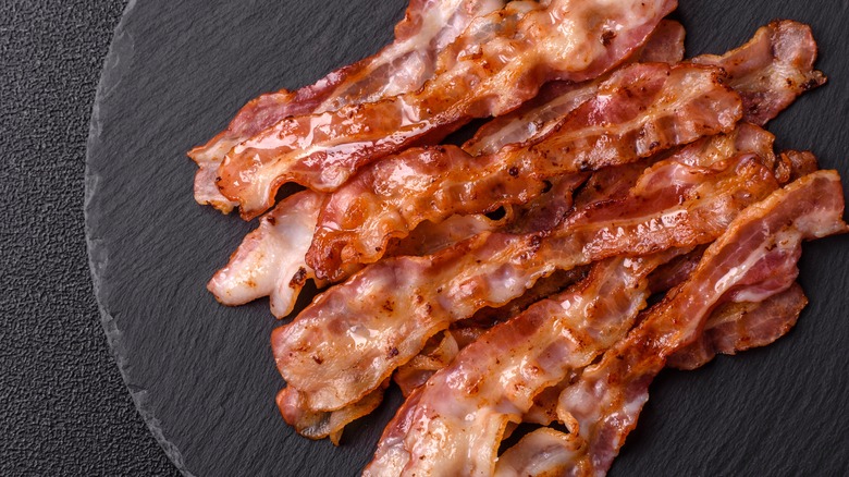 fried bacon on a gray surface