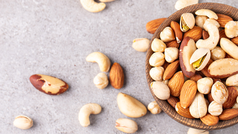 a bowl of mixed nuts, including almonds, pistachios, and cashews